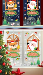 Detail view of Merry Christmas window decals with Santa, elk, and snowflakes on glass