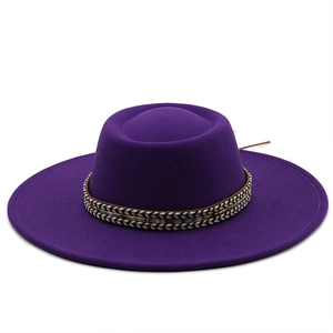 Detail of purple wide brim wool fedora hat featuring an ethnic colorful woven band