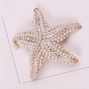 Starfish brooch with pearls and rhinestones showing 6.5cm x 6.8cm dimensions