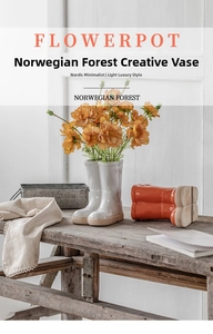 Detailed view of rain boot ceramic vases in milky white and terracotta on a wooden bench