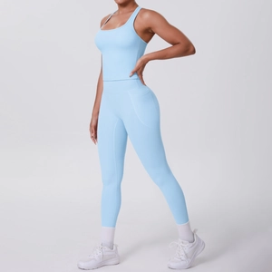 Detail of light blue yoga set with racerback tank top and side pocket leggings