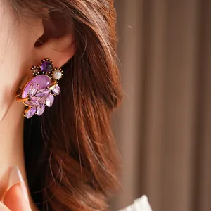 Vintage zircon leaf earrings with purple gemstones and pearls in luxury gold finish