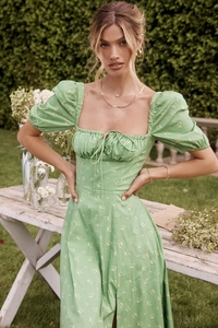 Detail of puff sleeves and green floral pattern on this summer vintage maxi dress