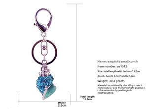Detailed size and weight specs for rhinestone conch keychain with blue crystal stones