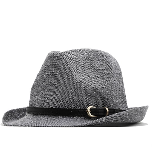 Close-up of grey sequined jazz hat with black leather band and golden buckle detail