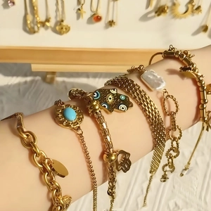 Gold Hamsa Hand and Evil Eye layered bracelet set with turquoise and baroque pearl accents