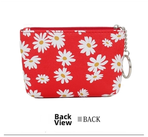 Back view of red daisy print coin purse featuring a zipper and metal keychain ring