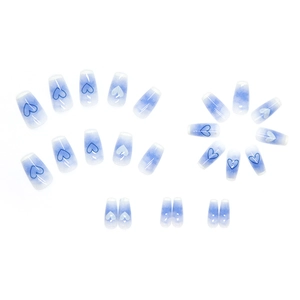 Blue and white gradient press-on nails with heart patterns on a clean white background