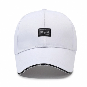 White baseball cap with black rectangle patch and FEWK lettered brim embroidery