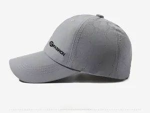 Detail of grey quick-dry baseball cap featuring side embroidery and laser-cut perforations