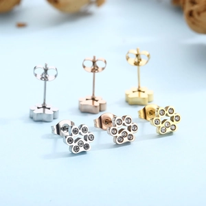 Three pairs of stainless steel paw print stud earrings in silver, gold and rose gold colors