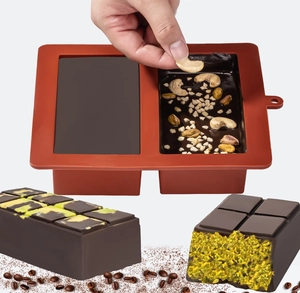 Detailed view of adding nuts into silicone chocolate mold bars for cake decoration