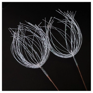 Macro shot of white sparkling SwanLace branches with glitter fibers for Christmas decor