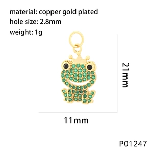 Detail of 11x21mm copper gold plated frog pendant with green cubic zirconia pave