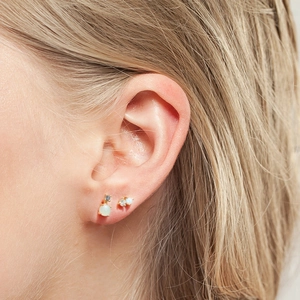 Golden sterling silver cartilage stud earrings featuring opal and cubic zirconia stones
