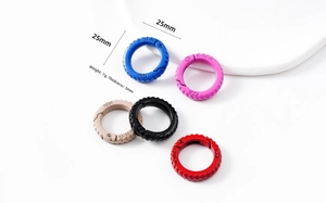 Detailed view of 25mm colorful round spring snap hooks with anti-slip textured surface