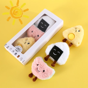Detail view of plush catnip toys in cute food shapes like rice ball and fried egg