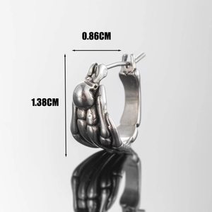 Gothic silver-tone skeleton hand hoop earring in a geometric punk style for unisex wear