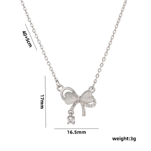 Elegant silver bow necklace with cat's eye stone and heart pendant, 40+5cm chain size