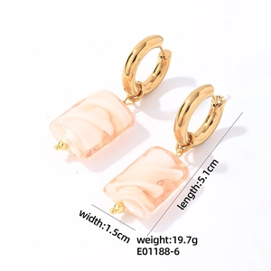 Detail view of pink marble stone pendants with gold stainless steel hoops measuring 5.1cm