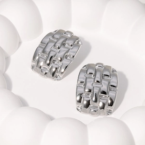 Polished silver-colored stainless steel stud earrings featuring a rectangular woven texture