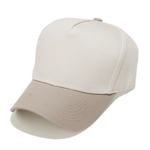 Detail of a 5-panel baseball cap showing khaki visor stitching and cream canvas crown