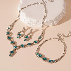 Vintage jewelry set with sea blue rhinestones including necklace, bracelet and earrings