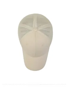 Top-down view of beige mesh trucker hat featuring breathable panels and cotton twill brim