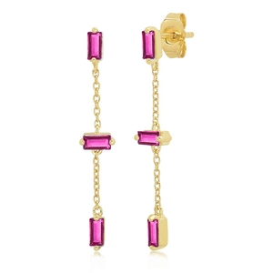 Detail of gold dangle earrings with triple pink rectangular zircons and long tassels