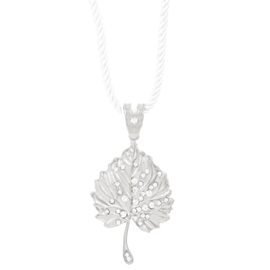 Detailed macro view of silver leaf pendant with sparkling rhinestones and textured veins