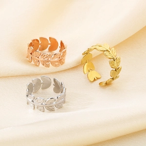 Three-color French leaf open rings in 18K gold-plated stainless steel on silk