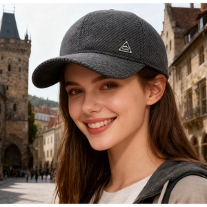 Detail of grey winter baseball cap with silver ProHike emblem and twill fabric texture