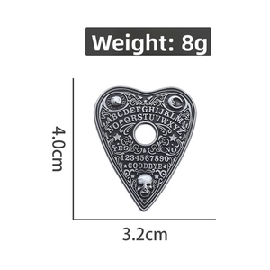 Detailed view of heart-shaped Ouija planchette brooch with size and 8g weight specs