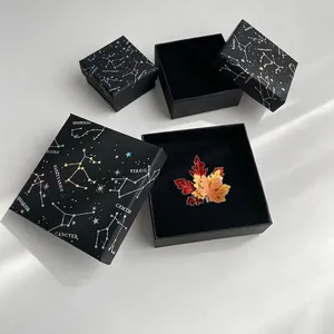 Luxurious maple leaf enamel brooch with gradient colors in a celestial gift box