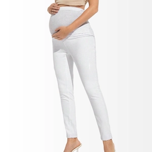 Detail of high waist maternity jeans in white with elastic belly support for comfort