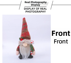 Close-up of Christmas gnome doll with heart-patterned knit hat and candy cane detail