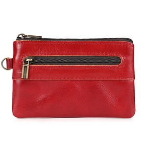 Detail view of red genuine leather coin purse with double zippers and gold hardware