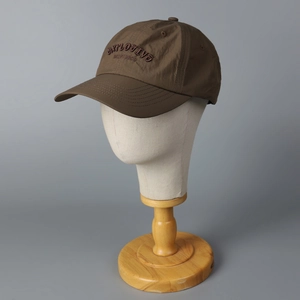 Brown baseball cap with EXPLOSIVE embroidery on a gray background for men and women