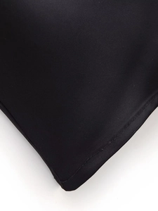 Detail of high-quality stitching and fabric texture on a black long-sleeve lace dress