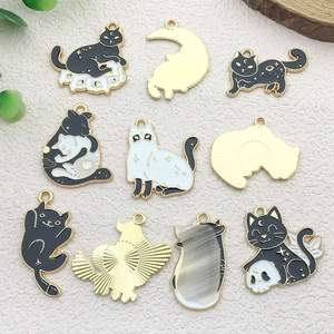 Detailed view of 10 enamel black cat and moon charms for DIY jewelry making accessories