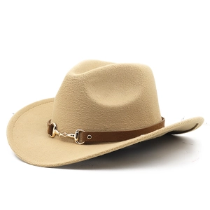 Detailed close-up of beige wool felt fedora with brown leather band and gold horsebit buckle