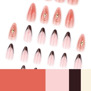 French almond press-on nails with 3D star charms and coral pink gradient design