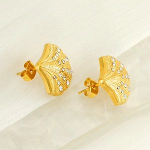 Elegant 18K gold plated shell stud earrings with sparkling crystals on white silk background