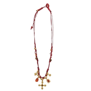 Bohemian woven red rope necklace with cross pendant and red agate beads on white background