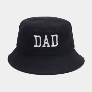 Detail of white DAD embroidery on a black cotton twill bucket hat with reinforced stitching