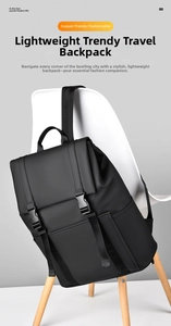 Detail of waterproof matte black backpack flap with dual buckle closures on modern chair