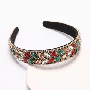 Detail of colorful marquise rhinestones and gold alloy frame on a baroque headband