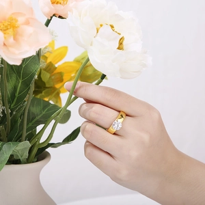 Titanium steel engagement ring with 6mm round zircon and wide gold band on a hand