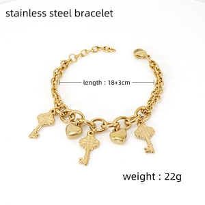 Gold stainless steel bracelet with key and heart charms, 18 plus 3cm length and 22g weight
