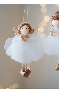 Detailed view of handmade Christmas angel doll with white mesh skirt and wooden shoes